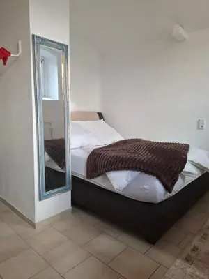 Ein Bett oder Betten in einem Zimmer der Unterkunft Holiday Flat Le jardin