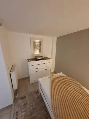 Ein Bett oder Betten in einem Zimmer der Unterkunft Holiday Flat Le jardin