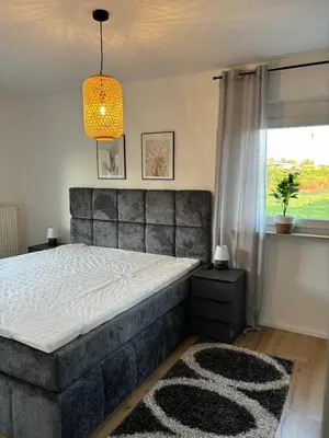 Ein Bett oder Betten in einem Zimmer der Unterkunft Ferienhaus Dresdener Ausblick