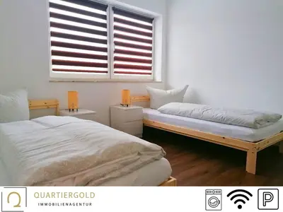 Ein Bett oder Betten in einem Zimmer der Unterkunft Monteurwohnung I WLAN I Parkplatz