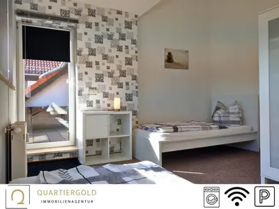 Ein Bett oder Betten in einem Zimmer der Unterkunft Monteurwohnung mit Stil