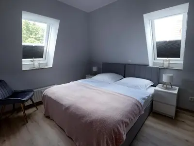 Ein Bett oder Betten in einem Zimmer der Unterkunft Ferienwohnung 