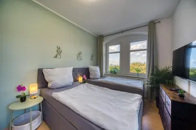 Ein Bett oder Betten in einem Zimmer der Unterkunft DresdenStay gemütlich Nähe Universität Kamin Parkplatz PS4