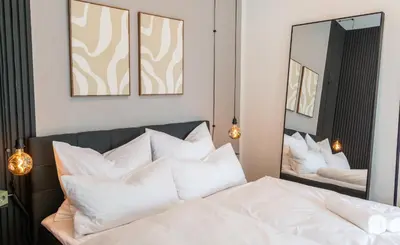 Ein Bett oder Betten in einem Zimmer der Unterkunft Maison & Mood Apartments Colditz I Design Studios