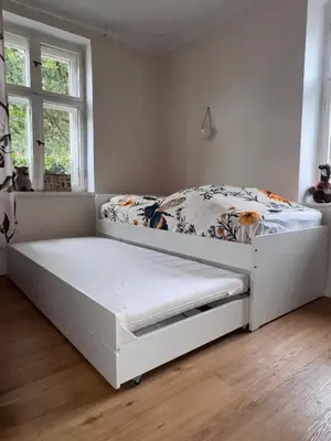 Ein Bett oder Betten in einem Zimmer der Unterkunft Ferienhaus Niemtsch -Alte Schule-