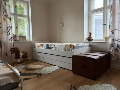 Ein Bett oder Betten in einem Zimmer der Unterkunft Ferienhaus Niemtsch -Alte Schule-