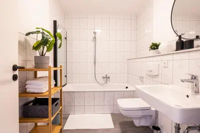 Ein Badezimmer in der Unterkunft GoldenKey Suites