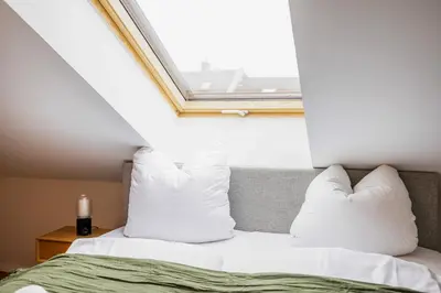 Ein Bett oder Betten in einem Zimmer der Unterkunft GoldenKey Suites