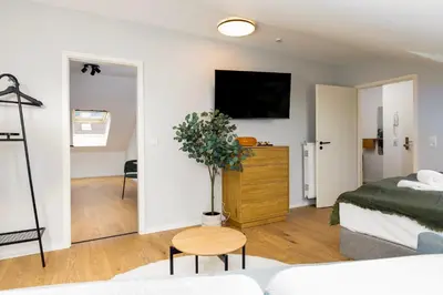 Ein Bett oder Betten in einem Zimmer der Unterkunft GoldenKey Suites