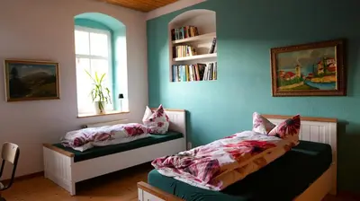 Ein Bett oder Betten in einem Zimmer der Unterkunft Landzeit Niedergräfenhain
