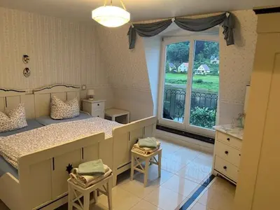 Ein Bett oder Betten in einem Zimmer der Unterkunft Ferienwohnung Bastei