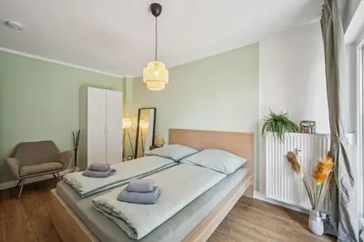 Ein Bett oder Betten in einem Zimmer der Unterkunft Royal Garden Residence
