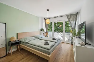 Ein Bett oder Betten in einem Zimmer der Unterkunft Royal Garden Residence