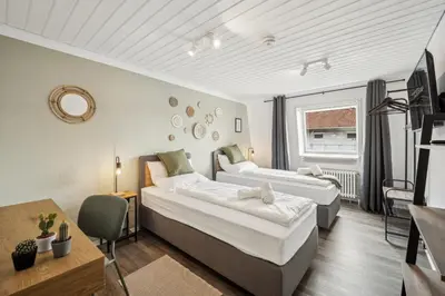 Ein Bett oder Betten in einem Zimmer der Unterkunft JuMar - 2-BR Apartment SunSet Nahe Elbe