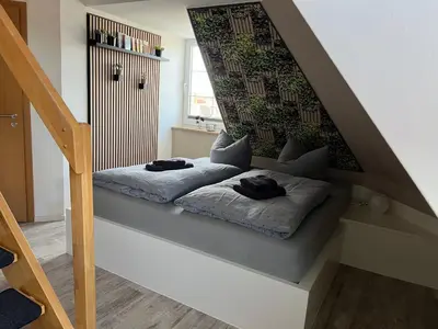 Ein Bett oder Betten in einem Zimmer der Unterkunft Ferienwohnung Maria mit Elbblick