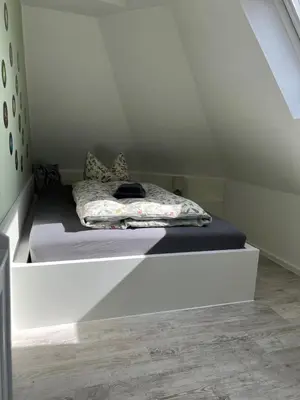 Ein Bett oder Betten in einem Zimmer der Unterkunft Ferienwohnung Maria mit Elbblick