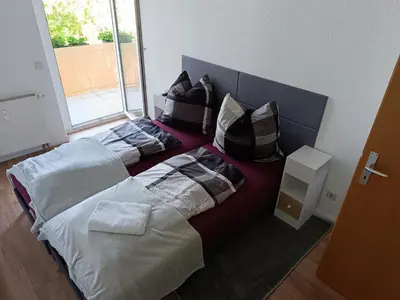 Ein Bett oder Betten in einem Zimmer der Unterkunft Sonnen Resort mit Balkon, 2 Schlafzimmer und mehr