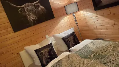 Ein Bett oder Betten in einem Zimmer der Unterkunft Relax Hütten & Spa Gröden