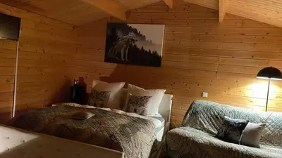 Ein Bett oder Betten in einem Zimmer der Unterkunft Relax Hütten & Spa Gröden
