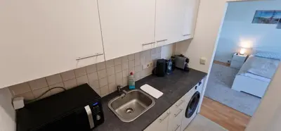 Küche/Küchenzeile in der Unterkunft StadtZentrum Apartment - Frei Parkplatz - Xbox