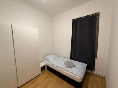 Ein Bett oder Betten in einem Zimmer der Unterkunft Monteurwohnungen in Wurzen östlich von Leipzig