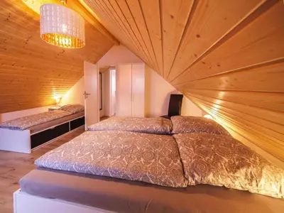 Ein Bett oder Betten in einem Zimmer der Unterkunft Ferienhaus am Partwitzer See, Elsterheide