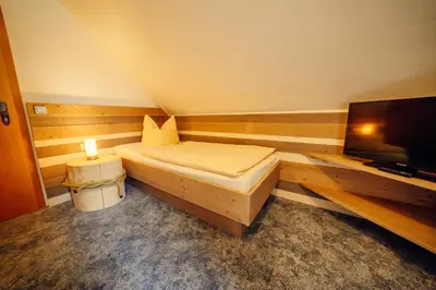 Ein Bett oder Betten in einem Zimmer der Unterkunft Hotel-Pension Hafemann