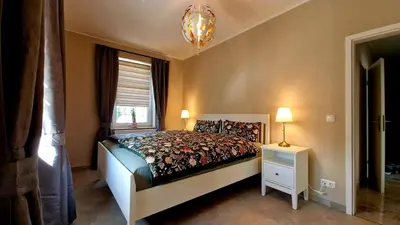 Ein Bett oder Betten in einem Zimmer der Unterkunft Augustusburger-Suites
