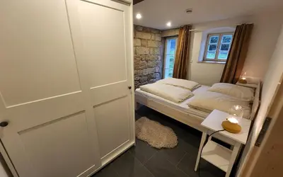 Ein Bett oder Betten in einem Zimmer der Unterkunft Vierseithof 