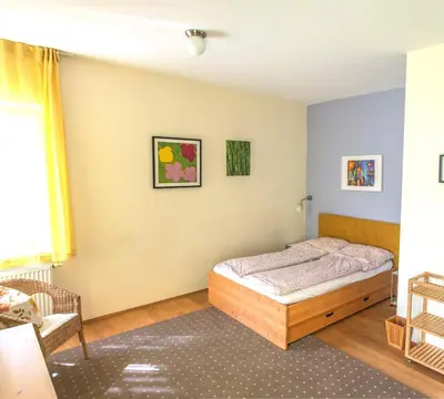 Ein Bett oder Betten in einem Zimmer der Unterkunft Ferienwohnung Villa 16F