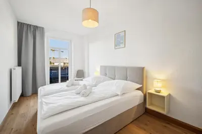 Ein Bett oder Betten in einem Zimmer der Unterkunft Großzügige Wohnung für Gruppen & Familien I Balkon
