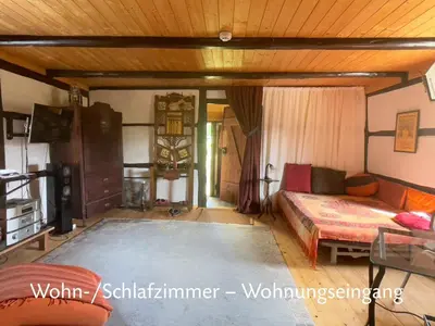Ein Bett oder Betten in einem Zimmer der Unterkunft Romantische und museal eingerichtete Ferienwohnung