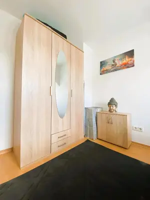 Ein Bett oder Betten in einem Zimmer der Unterkunft Gemütliches Altbauapartment III