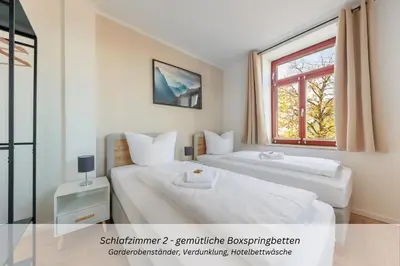 Ein Bett oder Betten in einem Zimmer der Unterkunft CASA BENJI Dohma - Familienfreundliche FeWo - Parkplatz - Waschmaschine