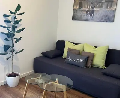 Ein Sitzbereich in der Unterkunft Ferienwohnung Auszeit am Schlossberg