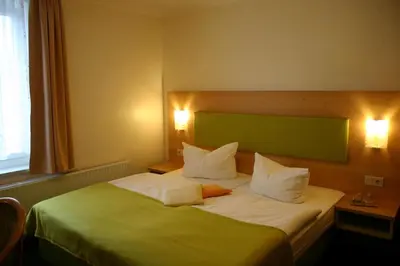 Ein Bett oder Betten in einem Zimmer der Unterkunft Gasthof Dittmannsdorf