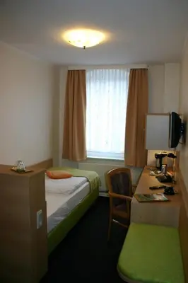 Ein Bett oder Betten in einem Zimmer der Unterkunft Gasthof Dittmannsdorf