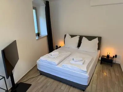 Ein Bett oder Betten in einem Zimmer der Unterkunft Cozy Castle Königstein - Moderne 69 qm Unterkunft