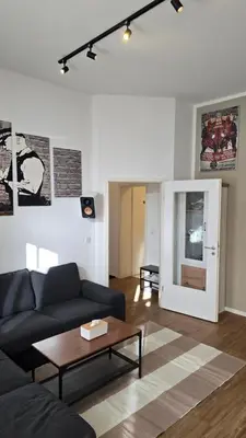 Ein Sitzbereich in der Unterkunft Kulturelles Businessapartment mit Balkon