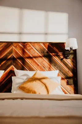 Ein Bett oder Betten in einem Zimmer der Unterkunft WALDGUT Naturresort