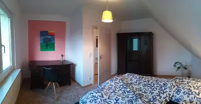 Ein Bett oder Betten in einem Zimmer der Unterkunft Gästehaus Hohnstein in der Sächsischen Schweiz