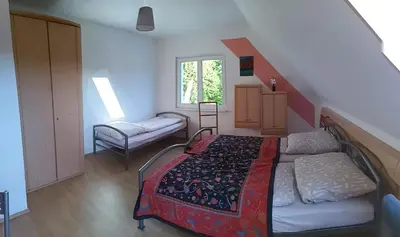 Ein Bett oder Betten in einem Zimmer der Unterkunft Gästehaus Hohnstein in der Sächsischen Schweiz