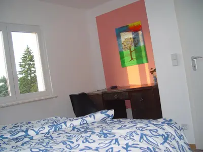 Ein Bett oder Betten in einem Zimmer der Unterkunft Gästehaus Hohnstein in der Sächsischen Schweiz