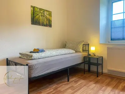 Ein Bett oder Betten in einem Zimmer der Unterkunft MonteurWohnung Fischbach App2