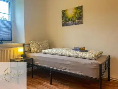 Ein Bett oder Betten in einem Zimmer der Unterkunft MonteurWohnung Fischbach App2