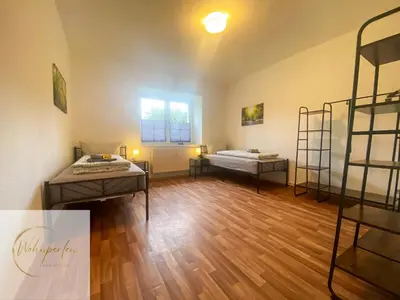 Ein Bett oder Betten in einem Zimmer der Unterkunft MonteurWohnung Fischbach App2