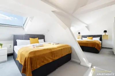Ein Bett oder Betten in einem Zimmer der Unterkunft Neu! PINEAPPLE APARTMENTS - Zwinger XII - 96qm - 1x free parking
