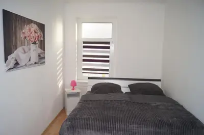 Ein Bett oder Betten in einem Zimmer der Unterkunft Sunshine