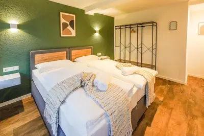 Ein Bett oder Betten in einem Zimmer der Unterkunft BaLa Suites Apartment House
