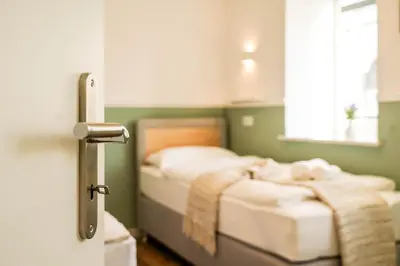 Ein Bett oder Betten in einem Zimmer der Unterkunft BaLa Suites Apartment House